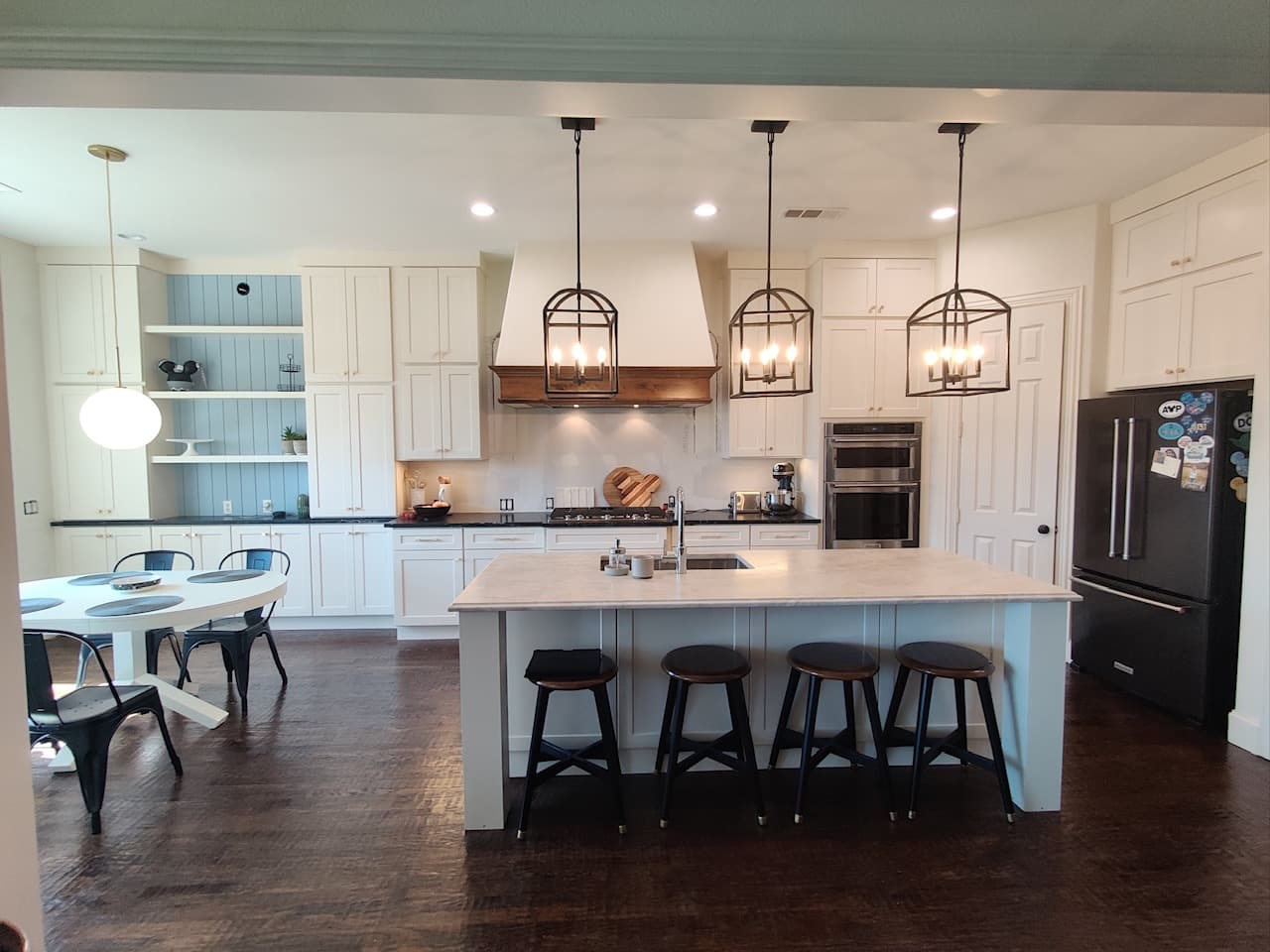 Modern luxury kitchen featuring premium custom walnut and white shaker cabinetry